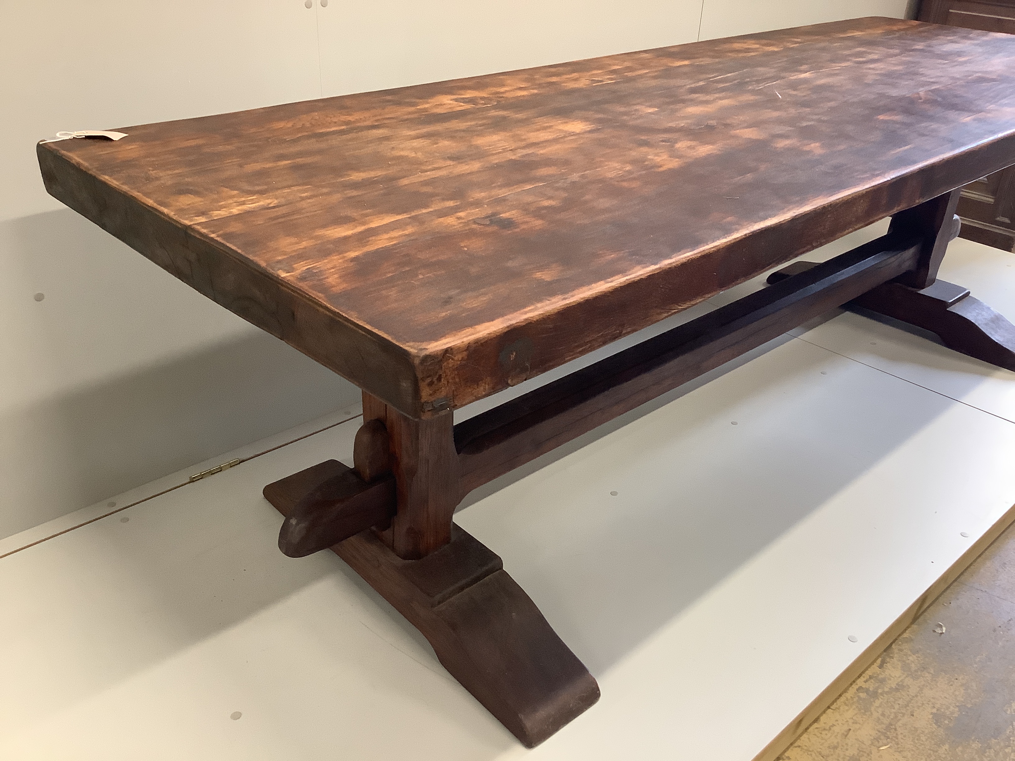 An 18th century style French rectangular oak refectory dining table, width 249cm, depth 87cm, height 77cm